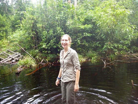 Student standing in river in the Rungan Forest 