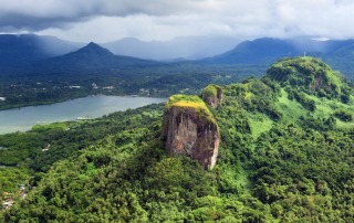 tunning aerial view of Sokehs Rock and its surrounding lush green hills in Pohnpei.
