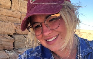 Headshot of Kate Rose, Director of Programs, taken at an archaeological site, highlighting her leadership in field-based archaeology education