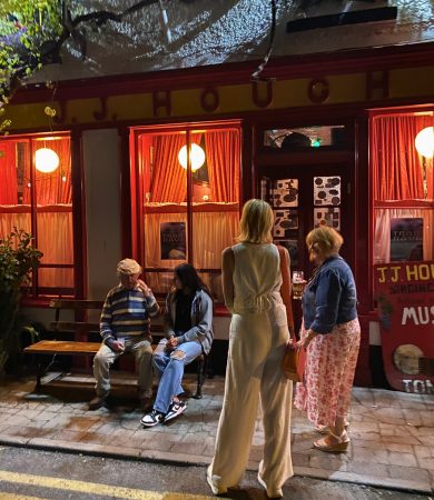 People gathered outside J.J. Hough's Singing Pub in Birr, enjoying the lively atmosphere of an iconic traditional Irish pub