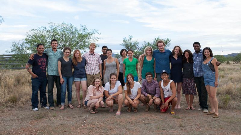 Jason De Leon surrounded by students at an ethnography field school in Chiapas, Mexico, posing together in an outdoor setting.