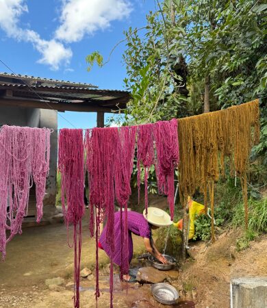 Dyeing textiles in Cajamarca Vibrantly colored dyed wool hanging to dry in a highland village