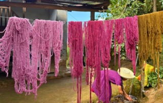 Vibrantly colored thread hanging out to dry in Cajamarca, Peru