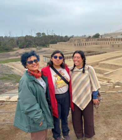Visit to Pachacamac complex with Cajamarca field school Students and professor smiling in front of a pre-columbian sanctuary complex
